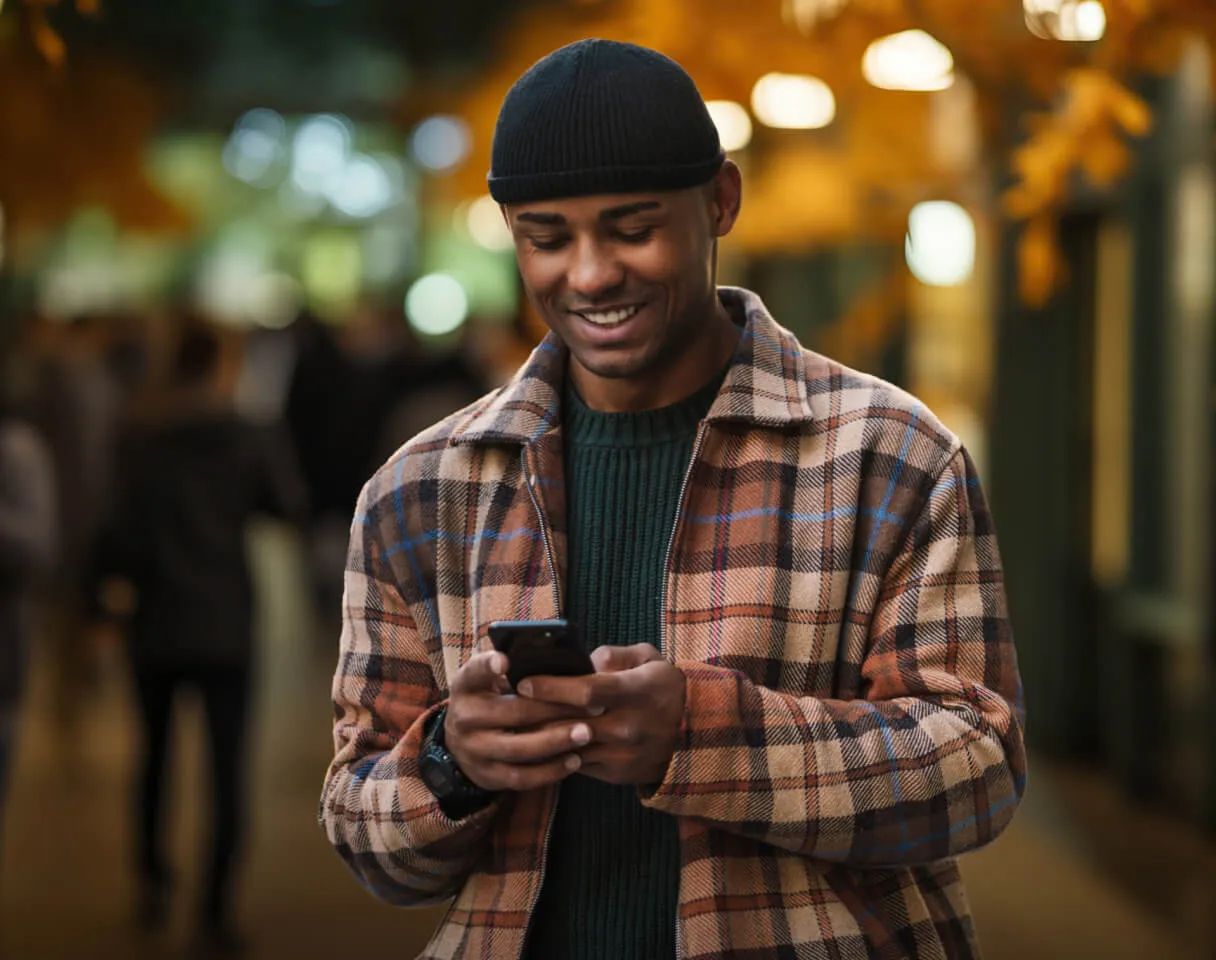 A man using his phone for mobile trading