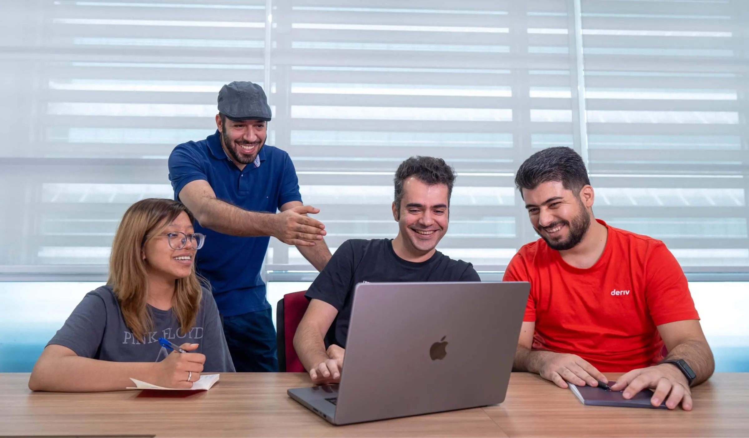 The mobile development looking at a laptop