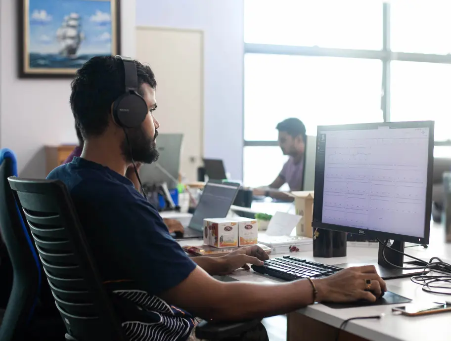 Back-end team member working on his computer