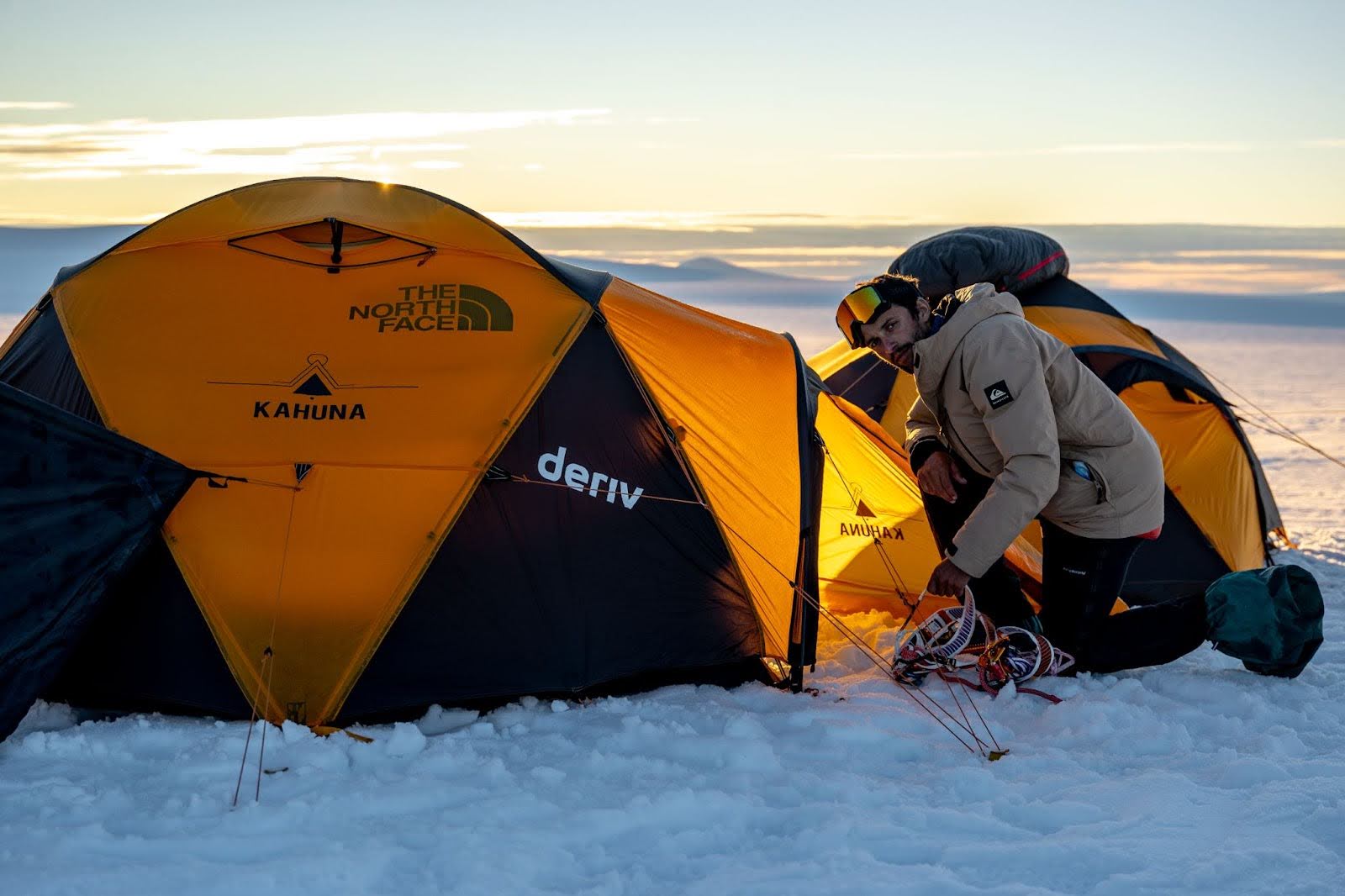 An explorer setting up the pulkas on the infinite glacier.