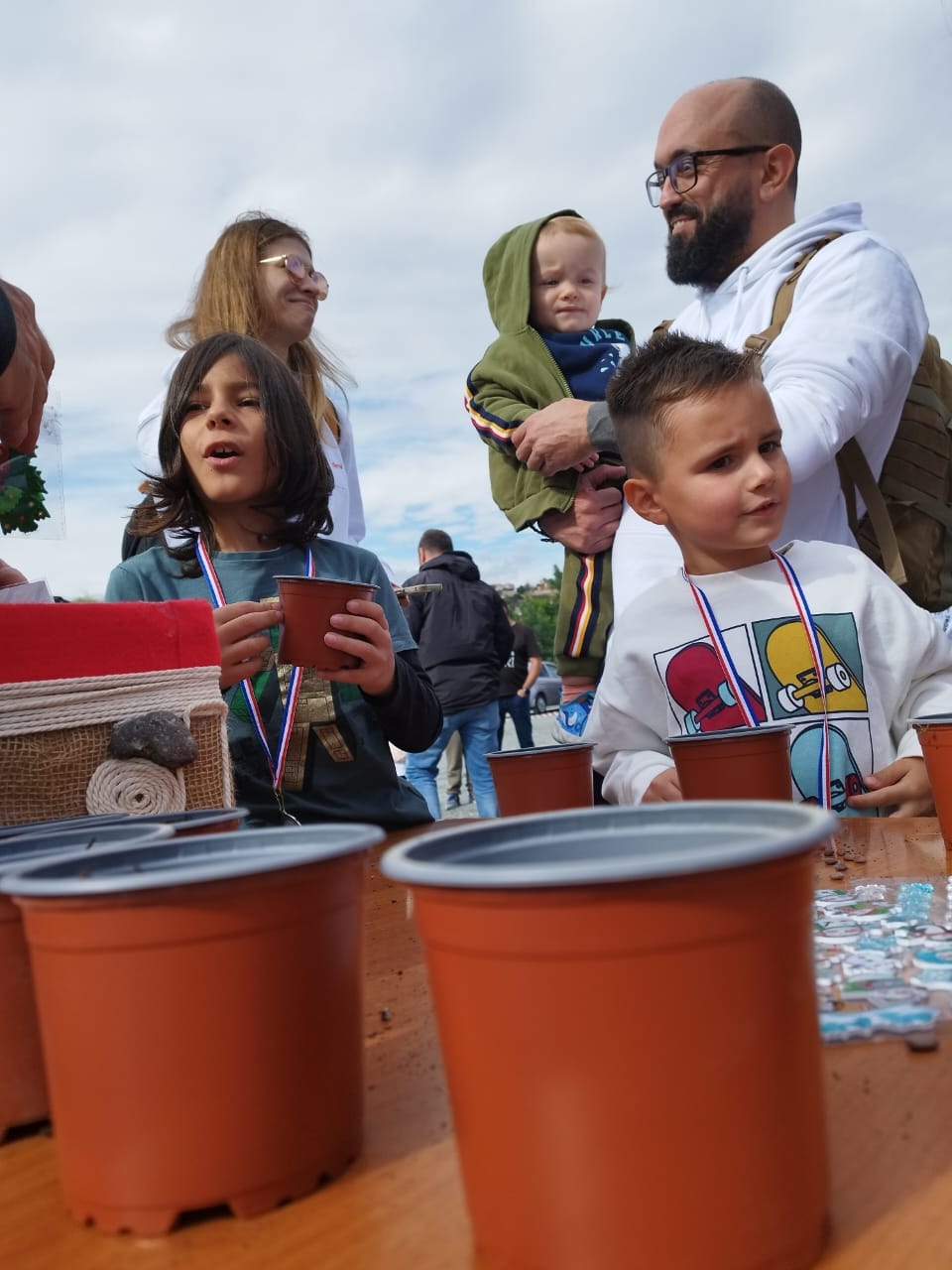 Deriv employees and their families at the You Reforest Cyprus programme.