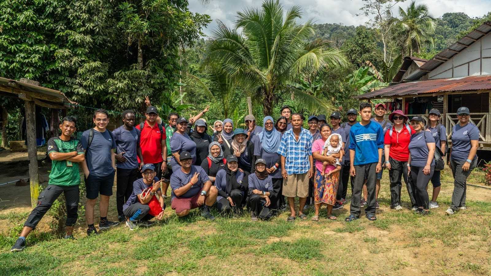 An image of Deriv employees in the Orang Asli village